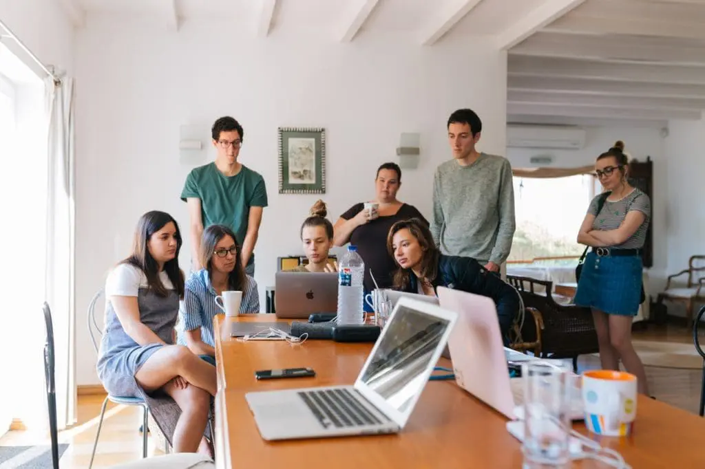 group of people watching on laptop 1595385