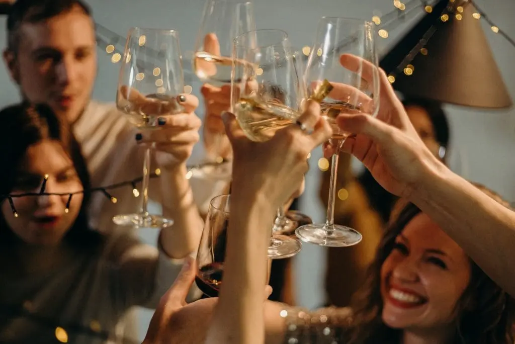 selective focus photography of several people cheering wine 3171815