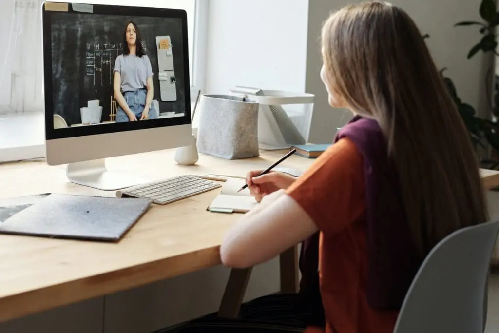 girl watching video using imac 4144225