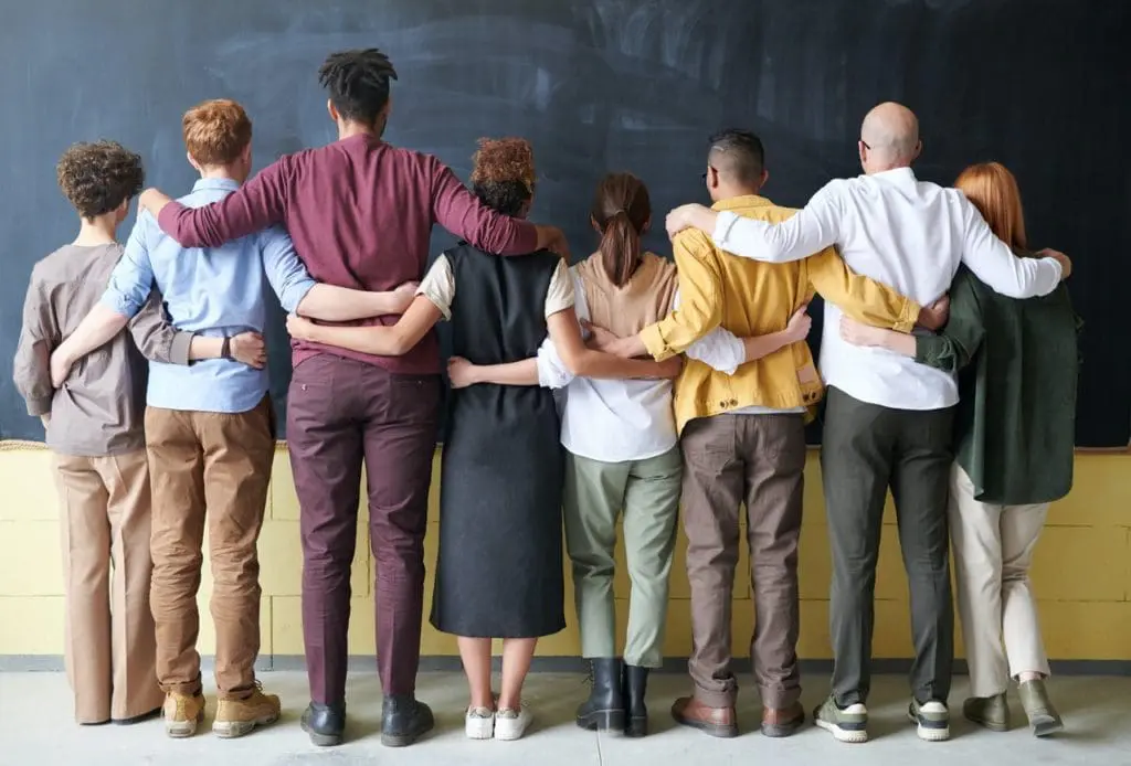 group of people standing indoors 3184396