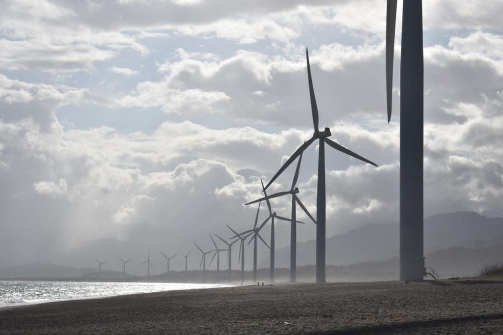 windmills on seashore under white clouds 1108814