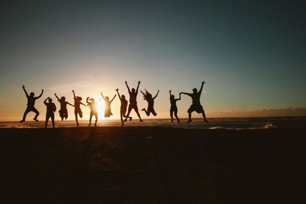 silhouette photography of group of people jumping during 1000445