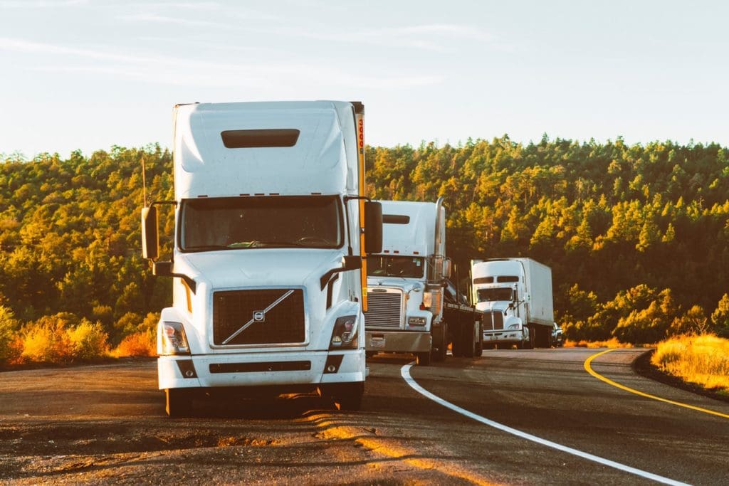 white volvo semi truck on side of road 2199293